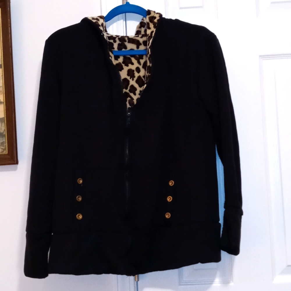 Super soft and comfortable black zip up hoodie with leopard print on the inside.